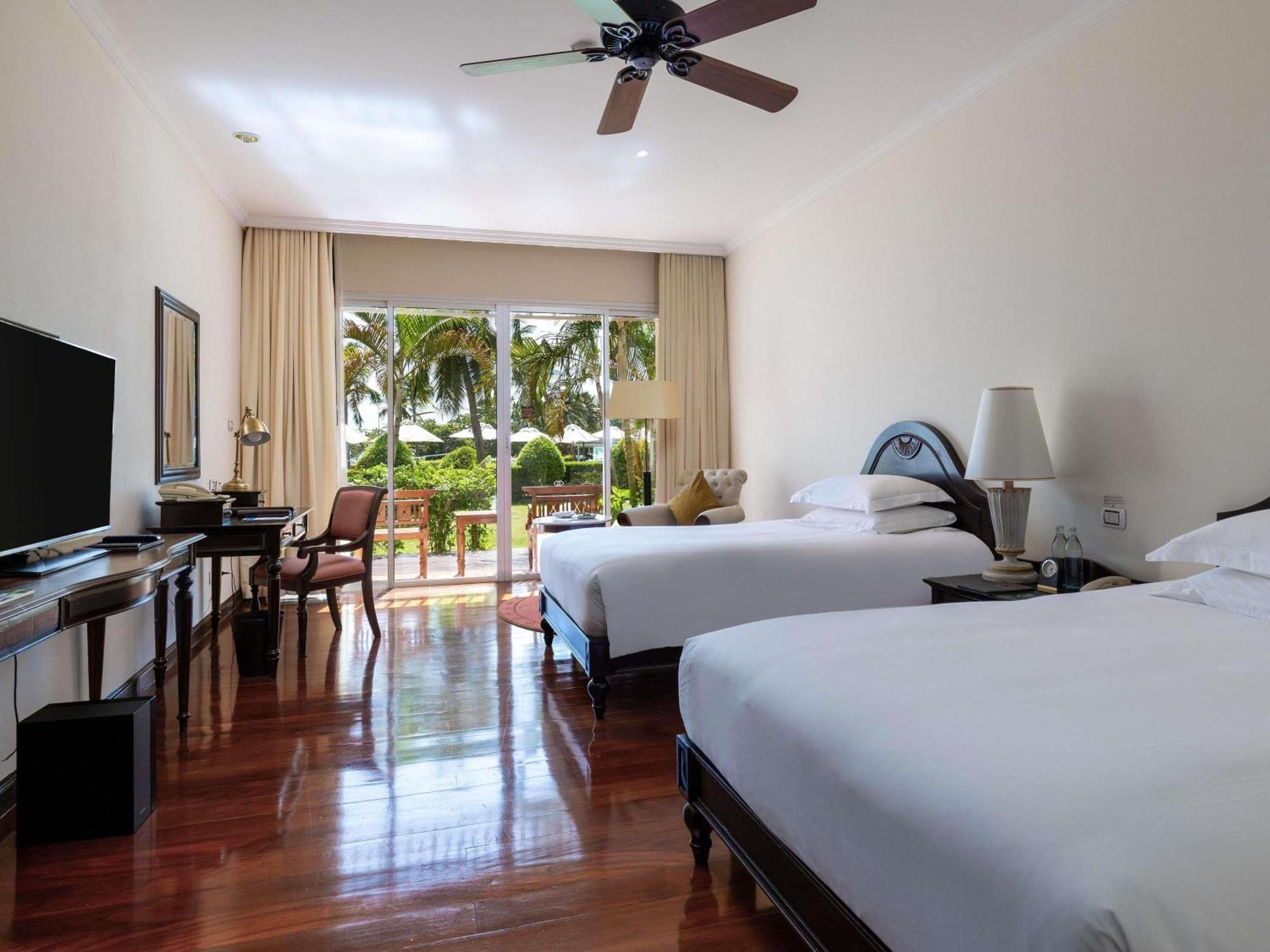 Two-Bedroom Family Room with One King Bed, Triple Bunk Bed, Two Single Beds and Private Balcony